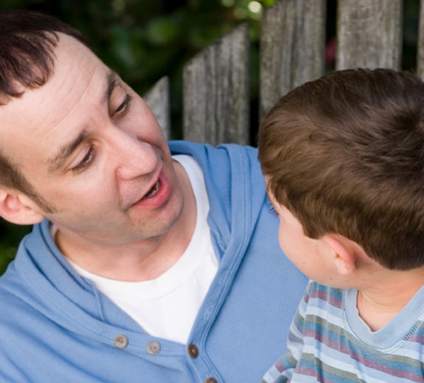 father talking to son